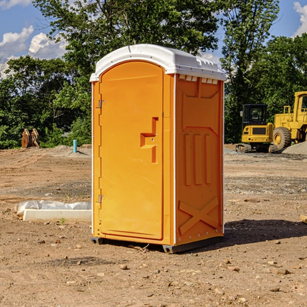 what is the cost difference between standard and deluxe portable restroom rentals in Freedom Plains